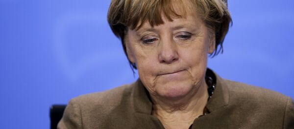 German Chancellor Angela Merkel reacts as she addresses a news conference after a meeting with state premiers at the Chancellery in Berlin, Germany, January 28, 2016 - Sputnik International