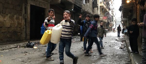 Children in Nubel, north of Aleppo province in Syria, after the town was released from a long-term siege Children in Nubel, north of Aleppo province in Syria, after the town was released from a long-term siege - Sputnik International