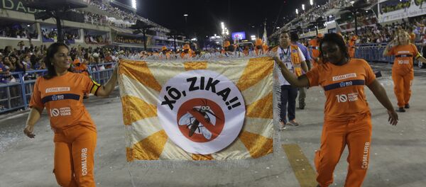 Workers holds a flag that reads in portugues Out Zika as part of a campaign to warn people about the spread of the Zika virus during carnival celebrations at the Sambadrome in Rio de Janeiro, Brazil, Monday, Feb. 8, 2016 Workers holds a flag that reads in portugues Out Zika as part of a campaign to warn people about the spread of the Zika virus during carnival celebrations at the Sambadrome in Rio de Janeiro, Brazil, Monday, Feb. 8, 2016 - Sputnik International