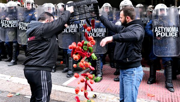 Farmers throw vegetables in front of the Agriculture ministry in Athens during a demonstration of farmers against the pension reform on February 12, 2016. - Sputnik International