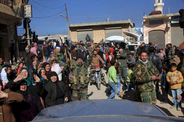 Residents of Nubul and al-Zahraa, along with forces loyal to Syria's President Bashar al-Assad, celebrate after the siege of their towns was broken, northern Aleppo countryside, Syria, in this handout picture provided by SANA on February 4, 2016 Residents of Nubul and al-Zahraa, along with forces loyal to Syria's President Bashar al-Assad, celebrate after the siege of their towns was broken, northern Aleppo countryside, Syria, in this handout picture provided by SANA on February 4, 2016 - Sputnik International