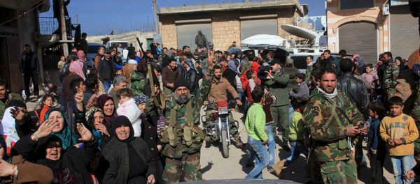 Residents of Nubul and al-Zahraa, along with forces loyal to Syria's President Bashar al-Assad, celebrate after the siege of their towns was broken, northern Aleppo countryside, Syria, in this handout picture provided by SANA on February 4, 2016 Residents of Nubul and al-Zahraa, along with forces loyal to Syria's President Bashar al-Assad, celebrate after the siege of their towns was broken, northern Aleppo countryside, Syria, in this handout picture provided by SANA on February 4, 2016 - Sputnik International