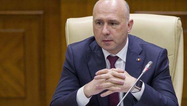 Moldova's Democratic Party member of parliament and newly elected prime minister Pavel Filip attends a session of parliament in Chisinau, Moldova, January 20, 2016 - Sputnik International