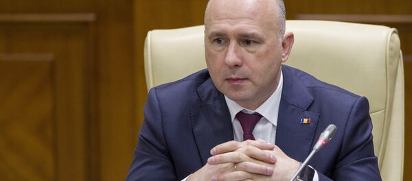 Moldova's Democratic Party member of parliament and newly elected prime minister Pavel Filip attends a session of parliament in Chisinau, Moldova, January 20, 2016 Moldova's Democratic Party member of parliament and newly elected prime minister Pavel Filip attends a session of parliament in Chisinau, Moldova, January 20, 2016 - Sputnik International