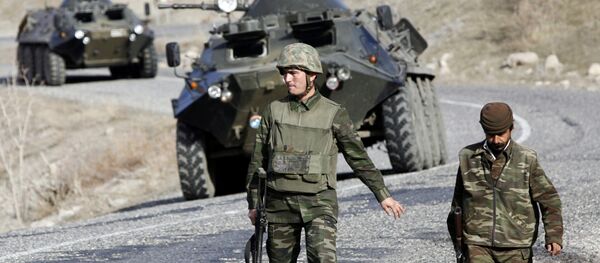 Turkish soldiers patrol a road near the Turkey-Iraq border in the mainly Kurdish southeastern province of Sirnak (File) - Sputnik International