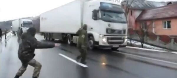 Nationalist activists in Ukraine blockade Russian trucks Nationalist activists in Ukraine blockade Russian trucks - Sputnik International