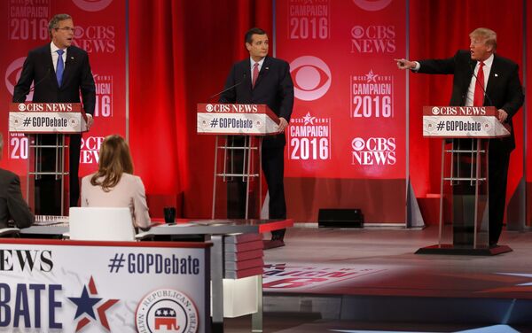 Republican U.S. presidential candidates former Governor Jeb Bush (L) and businessman Donald Trump (R) speak simultaneously about the war in Iraq and the record of Bush's brother, former President George W. Bush, as Senator Ted Cruz (C) looks on during the Republican U.S. presidential candidates debate sponsored by CBS News and the Republican National Committee in Greenville, South Carolina February 13, 2016. Republican U.S. presidential candidates former Governor Jeb Bush (L) and businessman Donald Trump (R) speak simultaneously about the war in Iraq and the record of Bush's brother, former President George W. Bush, as Senator Ted Cruz (C) looks on during the Republican U.S. presidential candidates debate sponsored by CBS News and the Republican National Committee in Greenville, South Carolina February 13, 2016. - Sputnik International