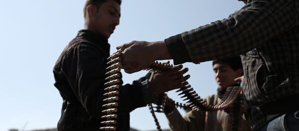 Opposition fighters belonging to Jaish al-Islam (Islam Army), the foremost rebel group in Damascus province who fiercely oppose to both the regime and the Islamic State group, check their ammunition belts in Tal al-Aswan in the area of the eastern Ghouta rebel bastion east of the Syrian capital, Damascus, during clashes with government forces on February 9, 2016. Opposition fighters belonging to Jaish al-Islam (Islam Army), the foremost rebel group in Damascus province who fiercely oppose to both the regime and the Islamic State group, check their ammunition belts in Tal al-Aswan in the area of the eastern Ghouta rebel bastion east of the Syrian capital, Damascus, during clashes with government forces on February 9, 2016. - Sputnik International