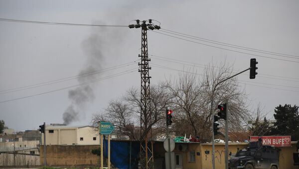 Smoke billows from a fire at the southeastern town of Nusaybin, Turkey, near the border with Syria, where Turkish security forces are battling militants linked to the Kurdistan Workers Party or PKK, Sunday, Feb. 14, 2016. - Sputnik International
