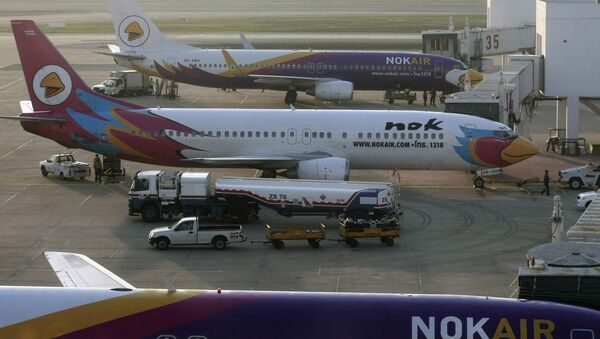 File photo, ground staff work on a fleet of Nok Air planes, a domestic budget airline, after the official reopen of Don Mueang airport in Bangkok, Thailand - Sputnik International