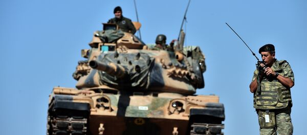 An officer speaks on the radio as Turkish tanks line up on a hill outside on the Turkish-Syrian border (file photo) An officer speaks on the radio as Turkish tanks line up on a hill outside on the Turkish-Syrian border (file photo) - Sputnik International