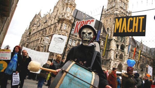 A protester takes part in a demonstration against the Munich Security Conference in downtown Munich, Germany, February 13, 2016. - Sputnik International