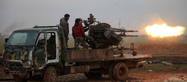 Forces loyal to Syrian President Bashar Assad fire towards Daesh terrorists south of the town of Al-Bab, in the northern province of Aleppo. file photo - Sputnik International
