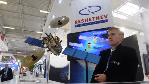 The stand of the JSC Information Satellite Systems - Reshetnev Company at the 51st International Paris Air Show - Le Bourget 2015 held at Le Bourget Exhibition Centre in France. (File) - Sputnik International