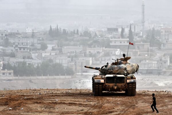 Turkish soldiers on a tank sit opposite the Syrian town of Ain al-Arab, known as Kobane by the Kurds, at the Turkish-Syrian border in the southeastern Turkish village of Mursitpinar, Sanliurfa province (File) Turkish soldiers on a tank sit opposite the Syrian town of Ain al-Arab, known as Kobane by the Kurds, at the Turkish-Syrian border in the southeastern Turkish village of Mursitpinar, Sanliurfa province (File) - Sputnik International