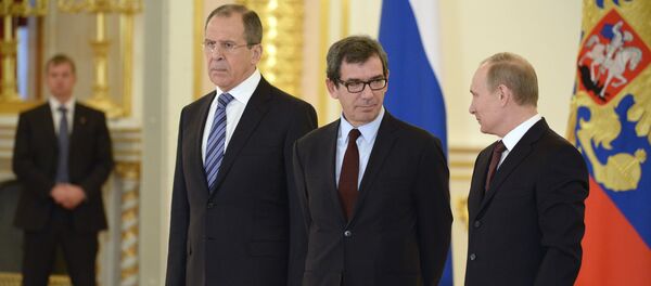 Russia's President Vladimir Putin (R), Russian Foreign Minister Sergei Lavrov (L) and new French ambassador to Russia, Jean-Maurice Ripert (C), attend a ceremony of receiving foreign ambassadors' credentials in Aleksandrovsky (Alexander's) Hall in Grand Kremlin Palace in Moscow, on January 16, 2014 Russia's President Vladimir Putin (R), Russian Foreign Minister Sergei Lavrov (L) and new French ambassador to Russia, Jean-Maurice Ripert (C), attend a ceremony of receiving foreign ambassadors' credentials in Aleksandrovsky (Alexander's) Hall in Grand Kremlin Palace in Moscow, on January 16, 2014 - Sputnik International