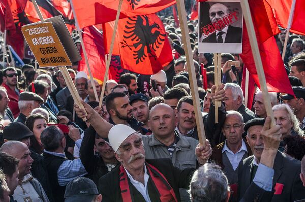 Kosovo Albanians, some holding Alkbania's flag, gather in Pristina on February 17,2016 for a major anti-government rally to mark their eighth anniversary of independence from Serbia. Kosovo Albanians, some holding Alkbania's flag, gather in Pristina on February 17,2016 for a major anti-government rally to mark their eighth anniversary of independence from Serbia. - Sputnik International
