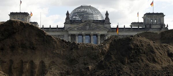 German Parliament building the Reichstag Building seen behind a pile of mud (File) German Parliament building the Reichstag Building seen behind a pile of mud (File) - Sputnik International