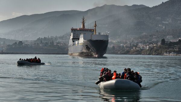 Refugees and migrants arrive on a dinghy at the port of Mytilene, on the Greek island of Lesbos, after crossing the Aegean sea from Turkey, on February 18, 2016 - Sputnik International