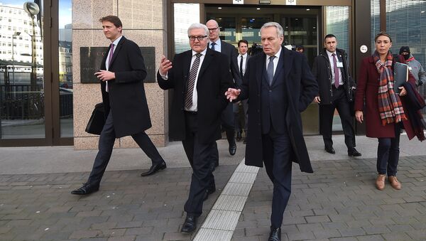 Germany's Foreign Minister Frank-Walter Steinmeier (2nd L) and France's Foreign Minister Jean-Marc Ayrault (3rd R) talk while leaving the European Council in Brussels after an EU foreign affairs council on February 15, 2016 - Sputnik International
