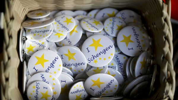 Badges with text 'I Love Schengen' are pictured at a store of the European museum of Schengen. - Sputnik International