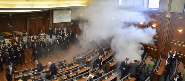 Opposition politicians release tear gas in parliament to obstruct a session in Pristina, Kosovo February 19, 2016 - Sputnik International