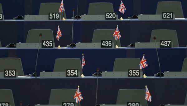 British Union Jack flags are seen on the desks of members of the European parliament ahead of a debate on the upcoming summit and EU referendum in the UK, in Strasbourg, France, February 3, 2016. - Sputnik International