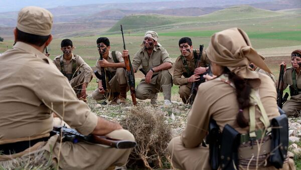 Iranian Kurdish Peshmerga members of the Kurdistan Democratic Party of (KDP-Iran) take part in routine military exercises in Koya, 100 kms north of Arbil, the capital of the autonomous Kurdish region of northern Iraq, on December 9, 2014 - Sputnik International