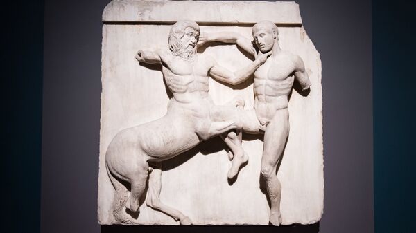 A marble metope sculpture (447-438BC) from the Parthenon in Athens, part of the collection that is popularly referred to as the Elgin Marbles, depicting a battle between a Centaur and a Lapith. - Sputnik International
