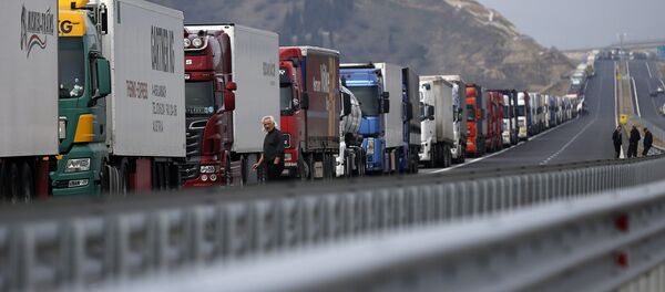Trucks are seen on a highway near the Kulata border crossing between Bulgaria and Greece, Bulgaria February 17, 2016 Trucks are seen on a highway near the Kulata border crossing between Bulgaria and Greece, Bulgaria February 17, 2016 - Sputnik International