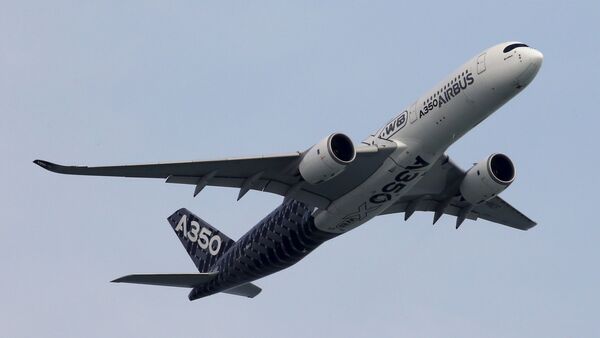 An Airbus A350 flies past during a preview aerial display of the Singapore Airshow at Changi exhibition center in Singapore February 14, 2016 - Sputnik International
