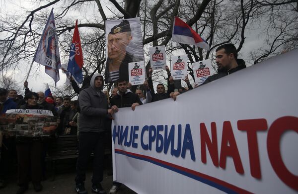 Protesters holding a banner that reads: Serbia is not NATO during a protest against NATO in downtown Belgrade, Serbia, Saturday, Feb. 20, 2016 Protesters holding a banner that reads: Serbia is not NATO during a protest against NATO in downtown Belgrade, Serbia, Saturday, Feb. 20, 2016 - Sputnik International