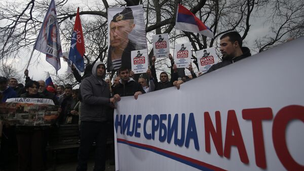 Protesters holding a banner that reads: Serbia is not NATO during a protest against NATO in downtown Belgrade, Serbia, Saturday, Feb. 20, 2016 - Sputnik International