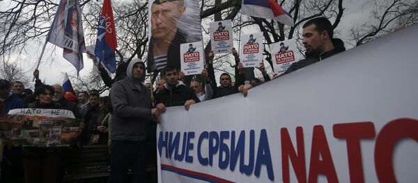 Protesters holding a banner that reads: Serbia is not NATO during a protest against NATO in downtown Belgrade, Serbia, Saturday, Feb. 20, 2016 Protesters holding a banner that reads: Serbia is not NATO during a protest against NATO in downtown Belgrade, Serbia, Saturday, Feb. 20, 2016 - Sputnik International