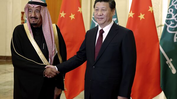 Chinese President Xi Jinping, right, shakes hands with Saudi Prince Salman bin Abdul-Aziz as they pose for photos at the Great Hall of the People in Beijing, China, Thursday, March 13, 2014 - Sputnik International