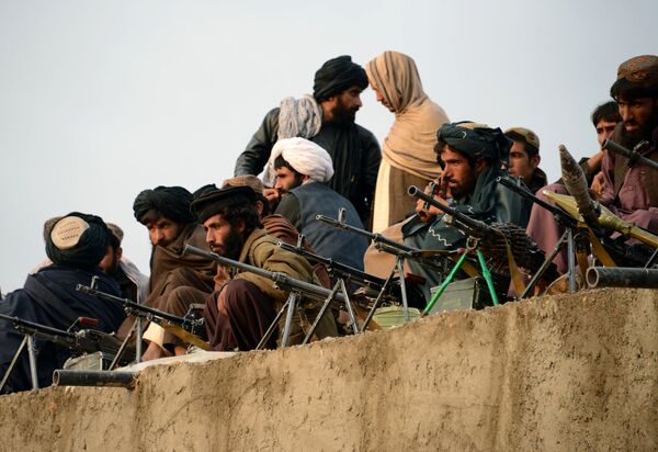 In this photograph taken on November 3, 2015, Afghan Taliban fighters listen to Mullah Mohammad Rasool Akhund (unseen), the newly appointed leader of a breakaway faction of the Taliban, at Bakwah in the western province of Farah In this photograph taken on November 3, 2015, Afghan Taliban fighters listen to Mullah Mohammad Rasool Akhund (unseen), the newly appointed leader of a breakaway faction of the Taliban, at Bakwah in the western province of Farah - Sputnik International