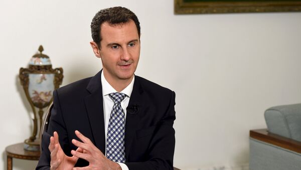 Syria's President Bashar al-Assad speaks during an interview with Spanish newspaper El Pais in Damascus, in this handout picture provided by SANA on February 20, 2016 - Sputnik International