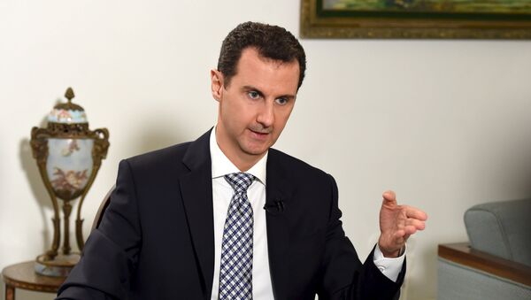 Syria's President Bashar al-Assad speaks during an interview with Spanish newspaper El Pais in Damascus, in this handout picture provided by SANA on February 20, 2016. - Sputnik International