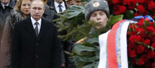 Russian President Vladimir Putin (L, front) attends a wreath laying ceremony to mark the Defender of the Fatherland Day at the Tomb of the Unknown Soldier by the Kremlin wall in central Moscow, Russia, February 23, 2016. Russian President Vladimir Putin (L, front) attends a wreath laying ceremony to mark the Defender of the Fatherland Day at the Tomb of the Unknown Soldier by the Kremlin wall in central Moscow, Russia, February 23, 2016. - Sputnik International