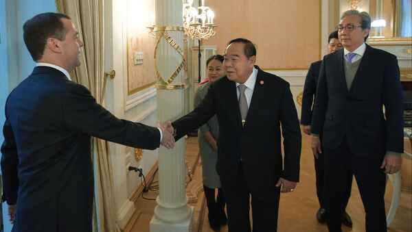 Russian Prime Minister Dmitry Medvedev, left, greets Thailand's Defense Minister Prawit Wongsuwon and Thailand's Deputy Prime Minister Somkit Chatusriphithak, right, during their meeting in Moscow, Russia - Sputnik International