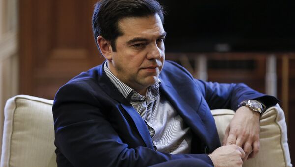 Greek Prime Minister Alexis Tsipras looks on during a meeting with Mayor of Piraeus Yannis Moralis (not pictured) at his office at the Maximos Mansion in Athens, Greece, February 11, 2016. - Sputnik International