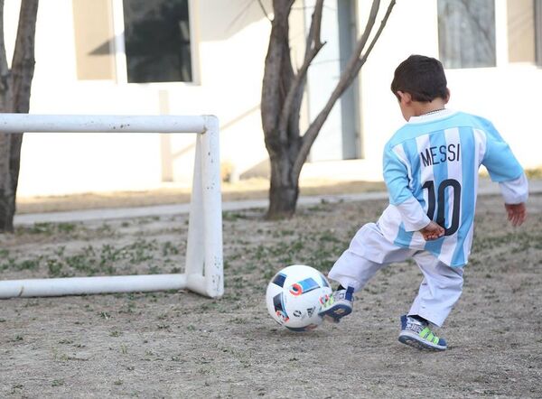 Murtaza Ahmadi can proudly show off the new signed jerseys and a football he received from UNICEF Goodwill Ambassador Leo Messi. Murtaza Ahmadi can proudly show off the new signed jerseys and a football he received from UNICEF Goodwill Ambassador Leo Messi. - Sputnik International