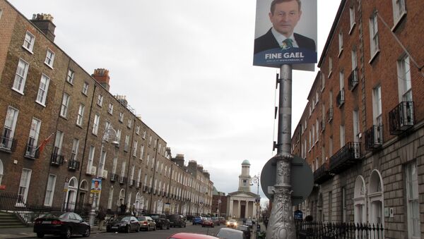 This photo taken Friday, Feb. 5, 2016, shows an election poster picturing Prime Minister Enda Kenny adorning a lamp post outside the headquarters of his Fine Gael party in Dublin, Ireland - Sputnik International