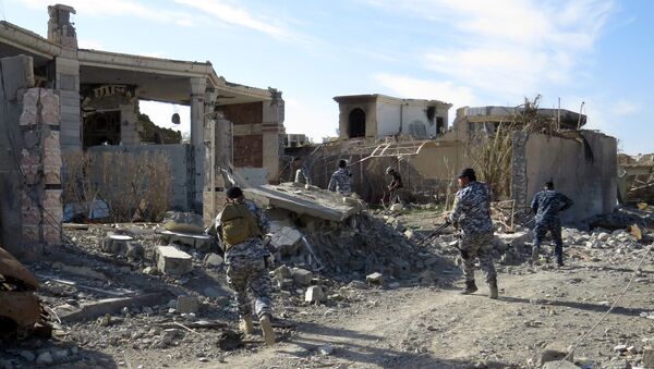 A file photo showing Iraq government troops remove bombs planted in houses and streets in Ramadi's Husseiba easten district on February 15, 2016 - Sputnik International