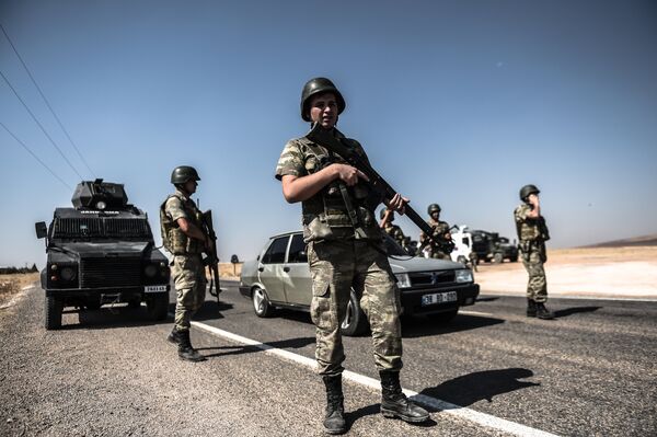 Turkish soldiers stand guar near the Turkey-Syrian border (File) Turkish soldiers stand guar near the Turkey-Syrian border (File) - Sputnik International