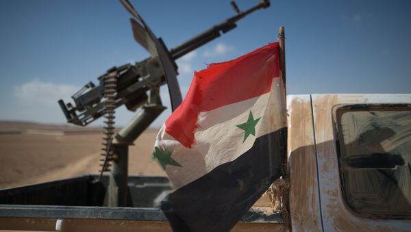 A Syrian flag on a truck with a machine gun of the Syrian Arab Army (SAA) near the town of Mhin, Syria - Sputnik International