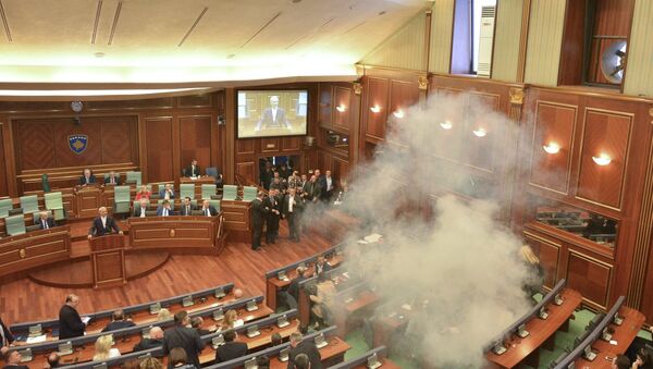 Tear gas is released during a session of parliament in Pristina, Kosovo February 26, 2016. Kosovo parliament is expected to vote the former Prime Minister and guerrilla commander Hashim Thaci as the new country's president despite opposition protests - Sputnik International