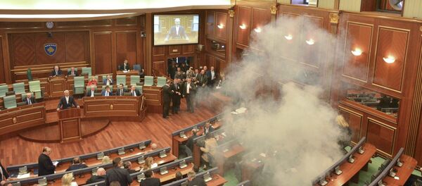 Tear gas is released during a session of parliament in Pristina, Kosovo February 26, 2016. Kosovo parliament is expected to vote the former Prime Minister and guerrilla commander Hashim Thaci as the new country's president despite opposition protests - Sputnik International