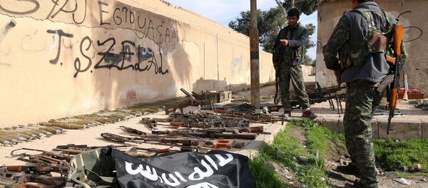 (File) Fighters from the Democratic Forces of Syria inspect weapons and ammunition that, according to them, belonged to Daesh fighters, in al-Shadadi town, in Hasaka province, Syria February 26, 2016 (File) Fighters from the Democratic Forces of Syria inspect weapons and ammunition that, according to them, belonged to Daesh fighters, in al-Shadadi town, in Hasaka province, Syria February 26, 2016 - Sputnik International