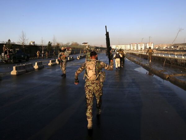 An Afghan security forces holds up his rifle as he walks at the site of an attack in Kabul, Afghanistan February 27, 2016 An Afghan security forces holds up his rifle as he walks at the site of an attack in Kabul, Afghanistan February 27, 2016 - Sputnik International